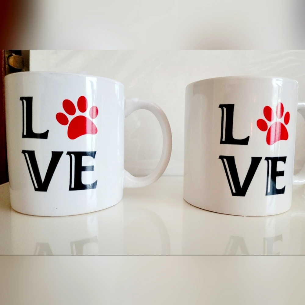 NWT Two coffee mugs with love and paw print on them.